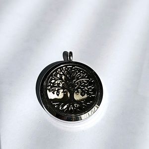 Silver tone tree locket pendant